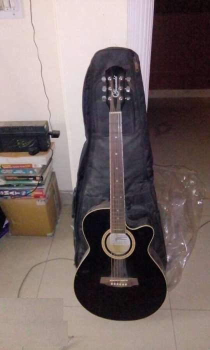 Acoustic guitar rarely used. with extra strings